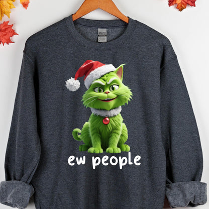 May include: Dark gray sweatshirt featuring a green cartoon cat wearing a Santa hat and a white collar with a red ornament. The text "ew people" is printed in white below the cat. The sweatshirt is hanging on a wooden hanger.