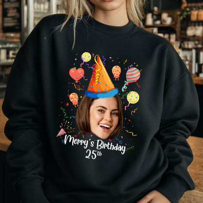 May include: Black sweatshirt with a colorful birthday design featuring a party hat, balloons, and confetti. The text "Merry's Birthday 25th" is printed on the sweatshirt.