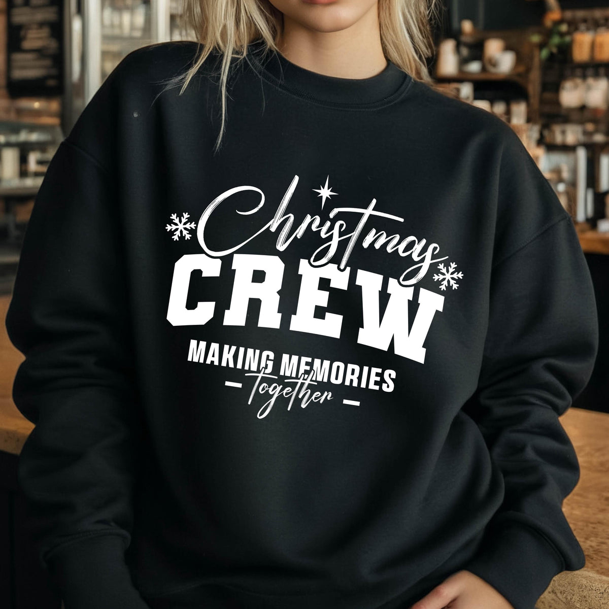May include: A black long-sleeve crewneck sweatshirt featuring white screen-printed text that reads Christmas CREW MAKING MEMORIES Together, accented with small snowflake icons and a star symbol centered above the word Christmas.