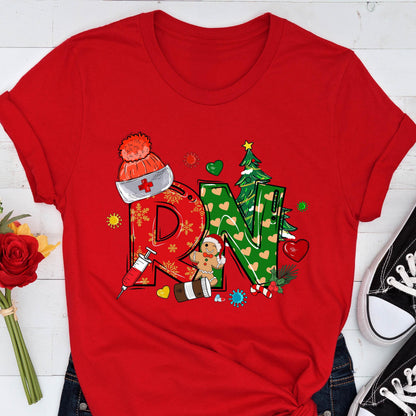 May include: A red t-shirt featuring a festive design with the letters "RN" in a Christmas theme. The "R" is adorned with a nurse's hat and snowflakes, while the "N" is decorated with hearts and a Christmas tree. A gingerbread man and syringe are also included.