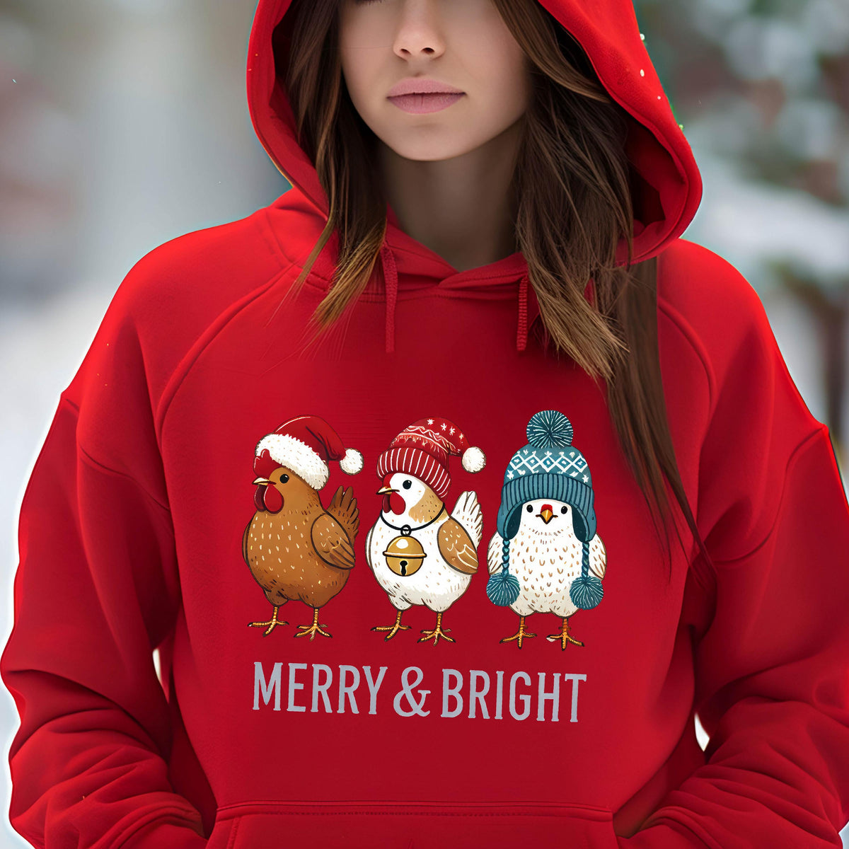 May include: Red hooded sweatshirt with a Christmas design featuring three cartoon chickens wearing Santa hats and a festive message that reads "Merry & Bright".
