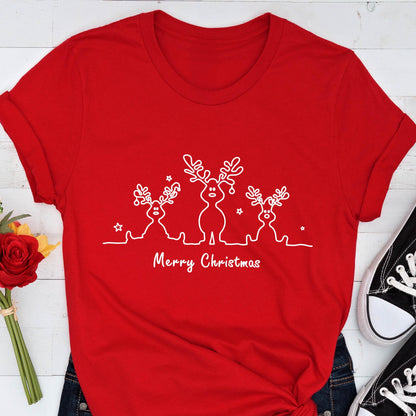 May include: A red t-shirt featuring a white line drawing of three reindeer with antlers and stars. The text "Merry Christmas" is printed below the reindeer design. The shirt has short sleeves.