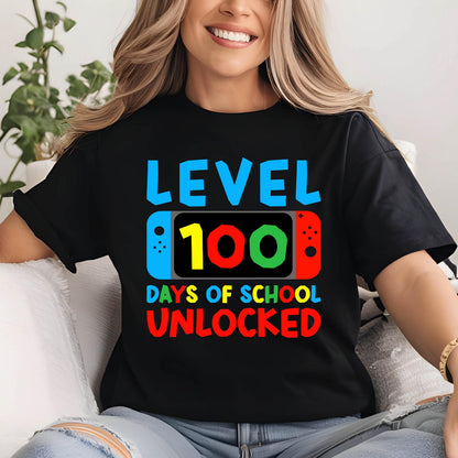 May include: Black t-shirt with a graphic of a video game controller with the text "Level 100 Days of School Unlocked".