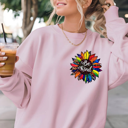 May include: Pink sweatshirt with a rainbow sunflower graphic and the text "Be Kind" in the center.