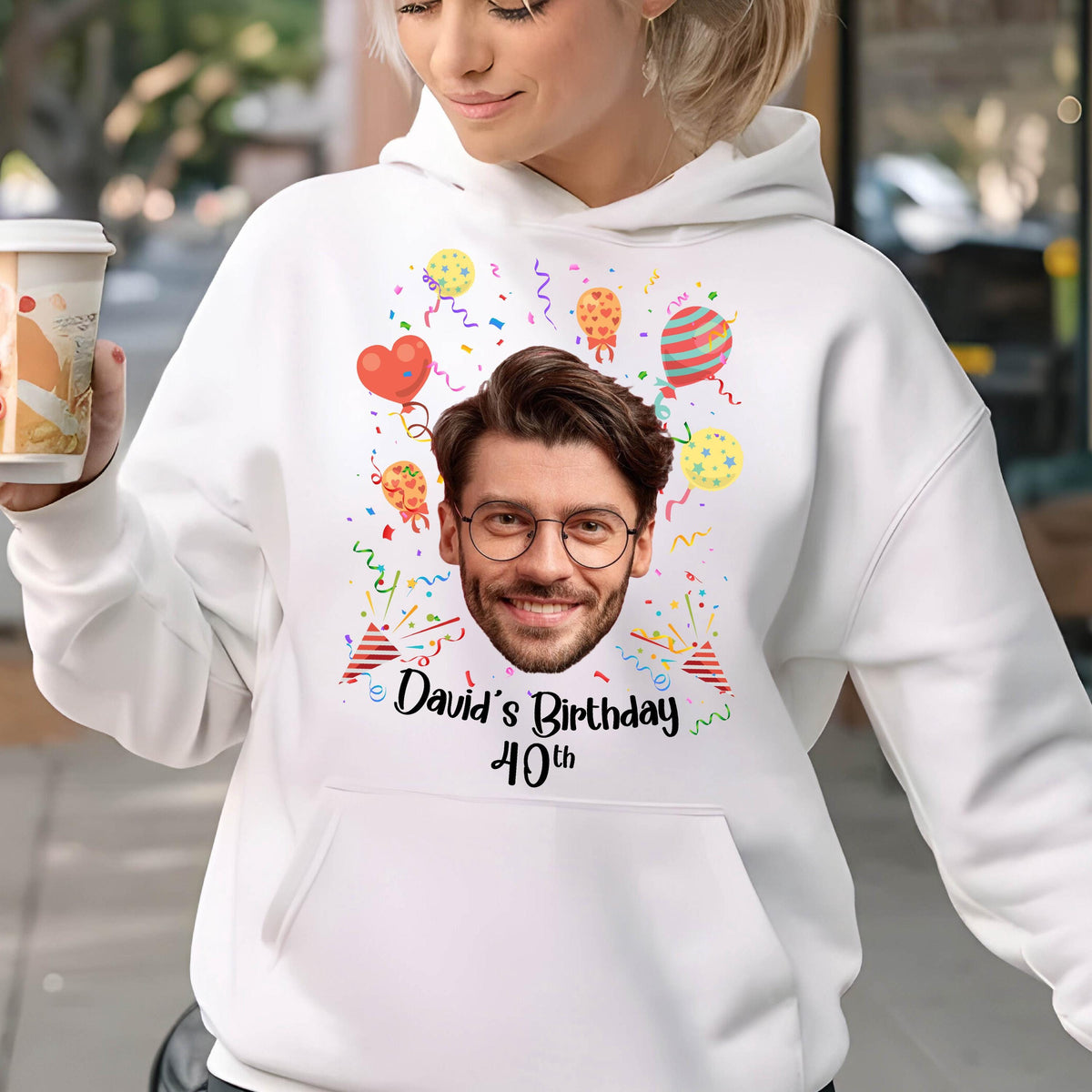 May include: White hoodie with a colorful birthday design featuring a person's face, balloons, confetti, and the text "David's Birthday 40th".