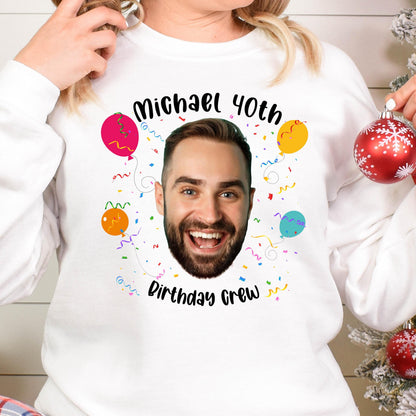 May include: White sweatshirt with a black graphic of a man's face with the text "Michael 40th Birthday Crew" and colorful confetti and balloons.
