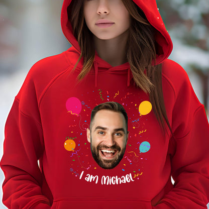May include: Red hoodie with a personalized design featuring a man's face, colorful balloons, confetti, and the text "I am Michael".