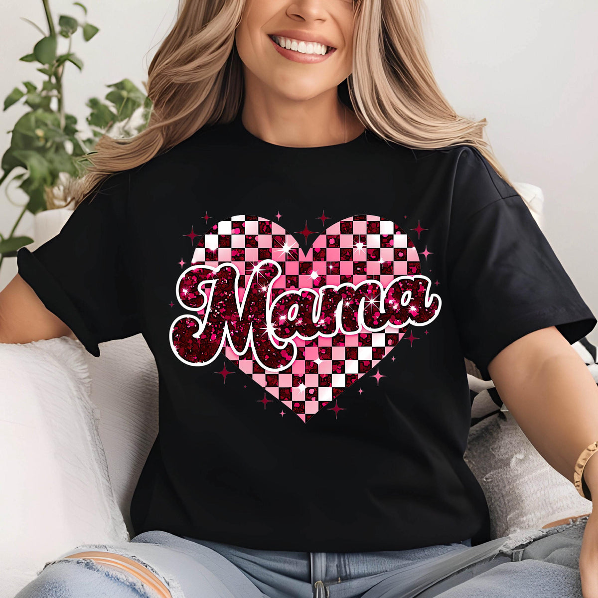 May include: Black t-shirt with a pink and white checkered heart design and the word "Mama" in a glittery pink font.