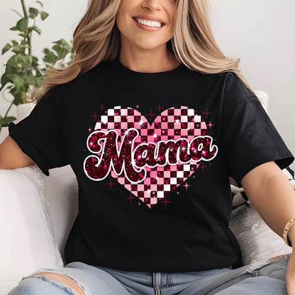 May include: Black t-shirt with a pink and white checkered heart design and the word "Mama" in a glittery pink font.