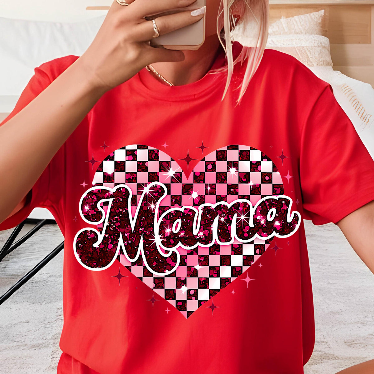 May include: Red t-shirt with a pink and white checkered heart design and the word "Mama" in a glittery pink font.
