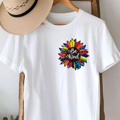 May include: White t-shirt with a colorful sunflower graphic and the text "Be Kind" in the center.