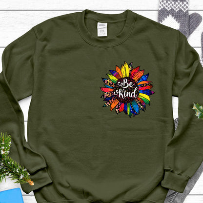 May include: A green sweatshirt with a colorful sunflower design and the text "Be Kind" in the center.