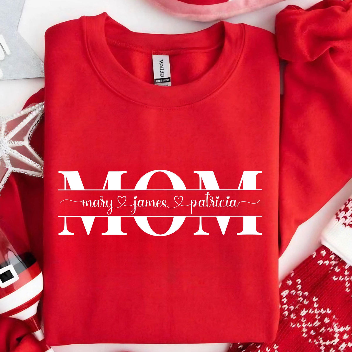 May include: Red sweatshirt with white text that reads "MOM" with the names "mary", "james", and "patricia" underneath.