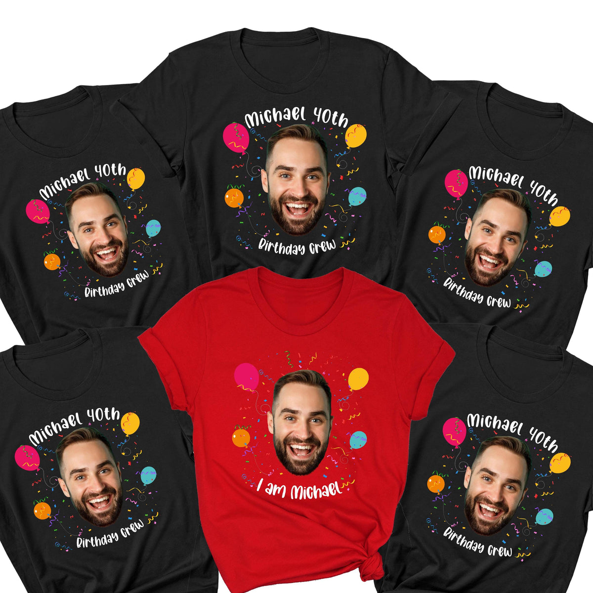 May include: A collection of five short-sleeved t-shirts, four black and one red, each featuring a printed graphic of a smiling man's face surrounded by colorful balloons and confetti. The black shirts read Michael 40th Birthday Crew, while the red shirt reads I am Michael.