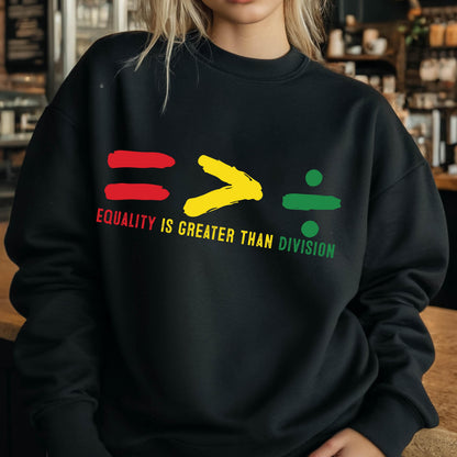 May include: Black sweatshirt with a graphic design of red, yellow, and green symbols representing equality, greater than, and division. The text "Equality is greater than division" is printed below the symbols.