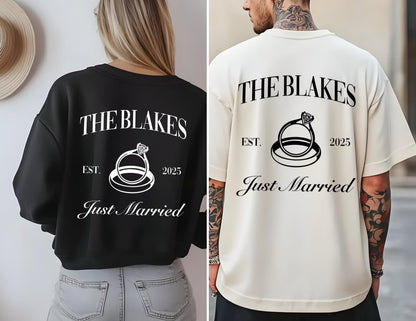 May include: Two black and white matching t-shirts with the text "The Blakes Est. 2025 Just Married" and a graphic of two interlocking rings with a diamond. 