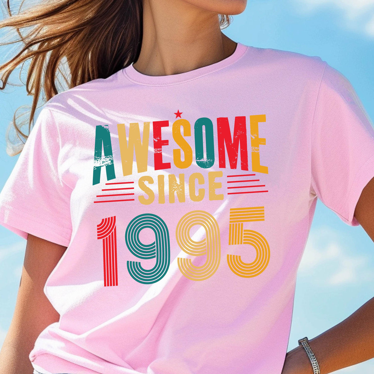 May include: Pink t-shirt with a vintage-style graphic that says "Awesome Since 1995" in rainbow colors.