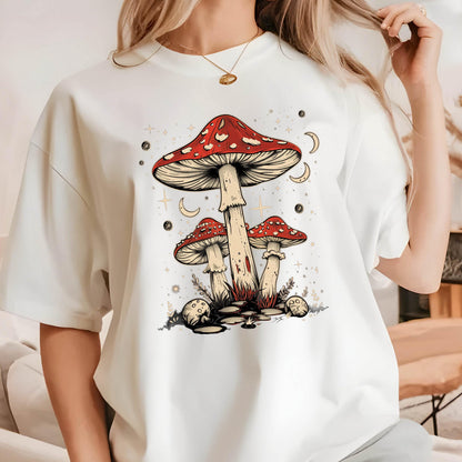 May include: White t-shirt with a graphic of three red and white mushrooms with a starry night sky background.
