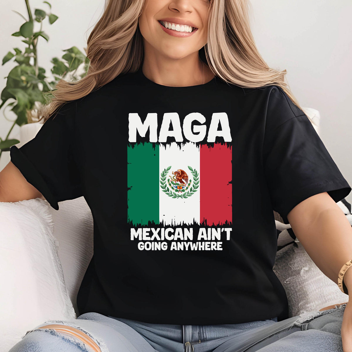 May include: Black t-shirt with a white graphic of the Mexican flag and the text "Maga Mexican Ain't Going Anywhere".