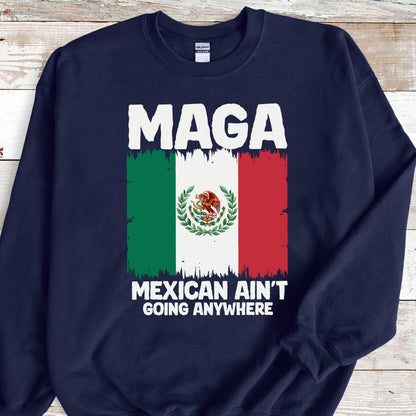 May include: Navy blue sweatshirt with a white graphic of the Mexican flag and the text "Maga Mexican Ain't Going Anywhere".
