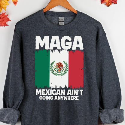 May include: Dark gray sweatshirt with the text "Maga Mexican Ain't Going Anywhere" and a distressed image of the Mexican flag.