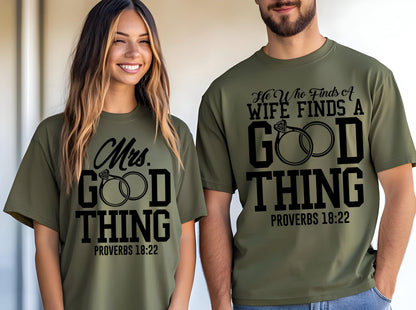 May include: Olive green t-shirts with matching text and graphics. One shirt says "Mrs. GOOD THING" with a ring graphic, and the other says "He Who Finds A WIFE FINDS A GOOD THING" with a ring graphic. Both shirts have "PROVERBS 18:22" printed below.