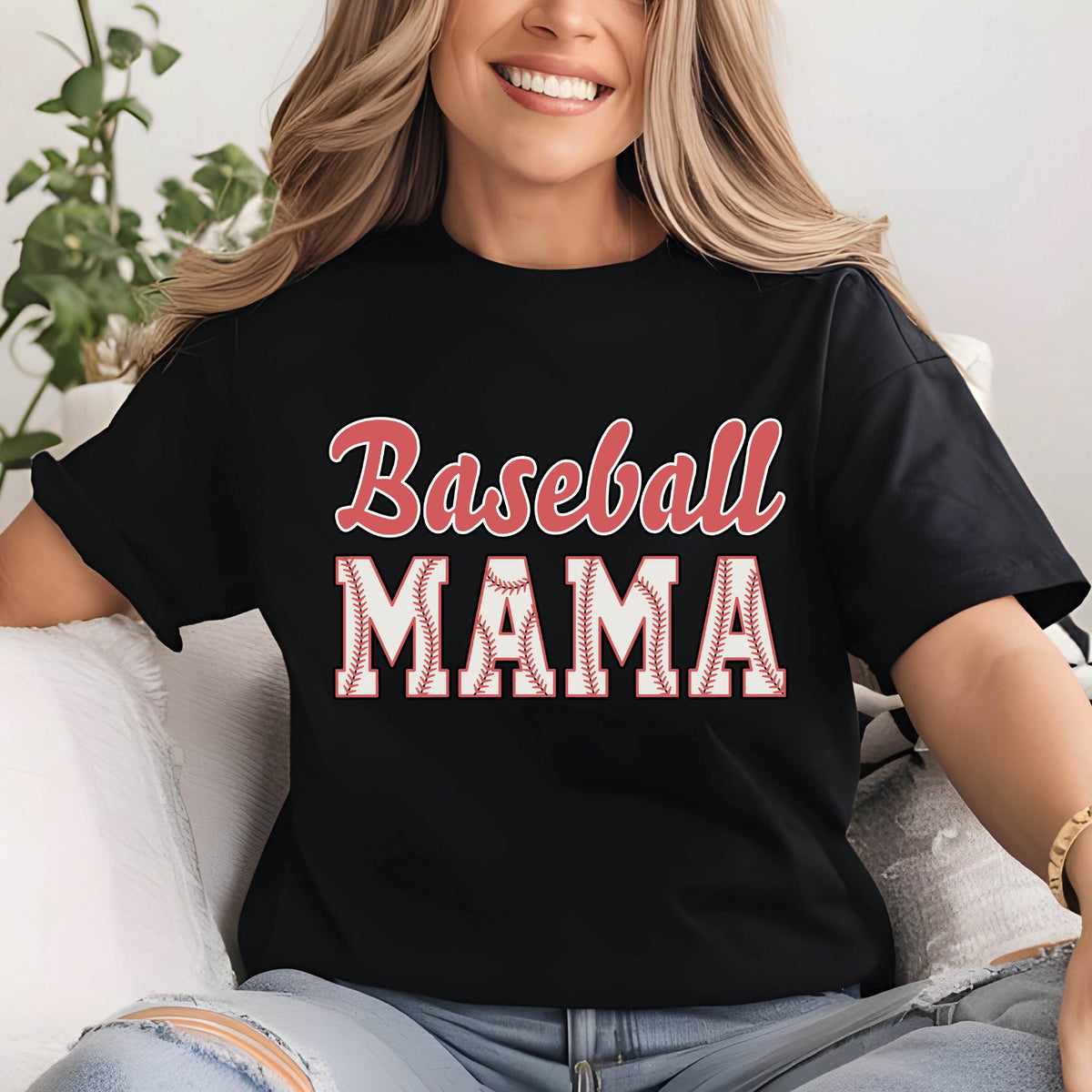 May include: Black t-shirt with the text "Baseball Mama" in red and white. The text is outlined in white and has a baseball stitch design.