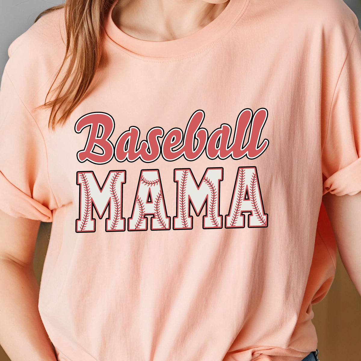 May include: A pink t-shirt with the text "Baseball Mama" in white letters with a baseball stitch design. The text "Baseball" is in red.