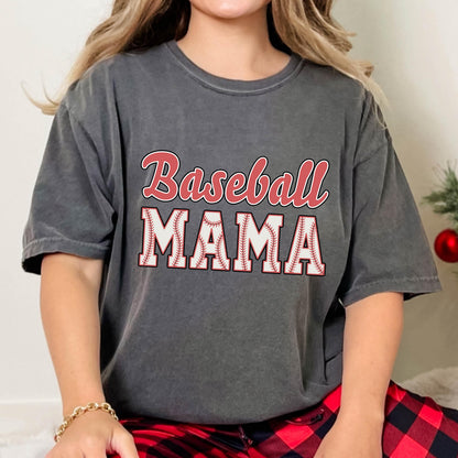 May include: A charcoal grey t-shirt with the text "Baseball Mama" in red and white. The word "Mama" is surrounded by a white baseball with red stitching.