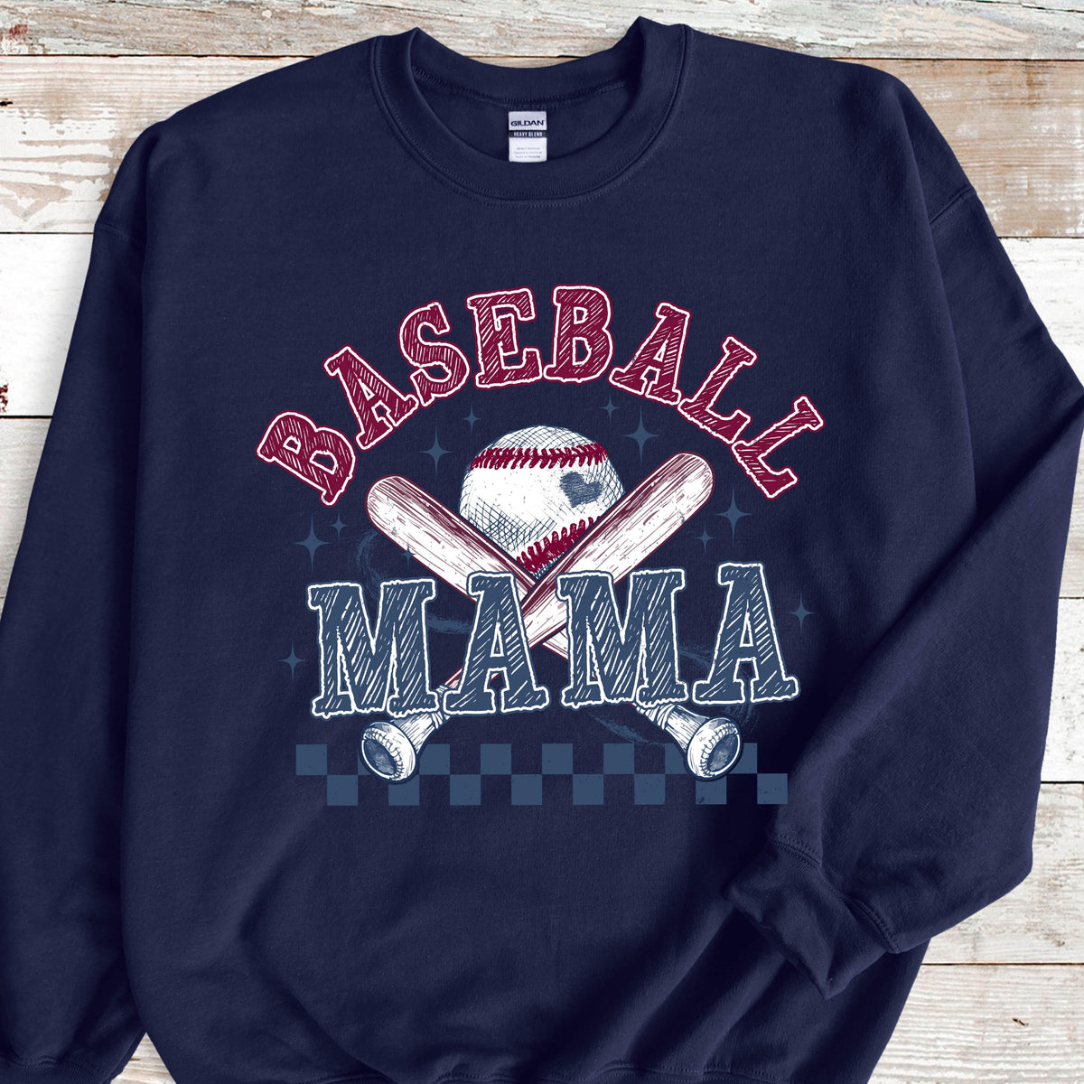 May include: Navy blue sweatshirt with a white baseball, two crossed bats, and the text "Baseball Mama" in red and white.
