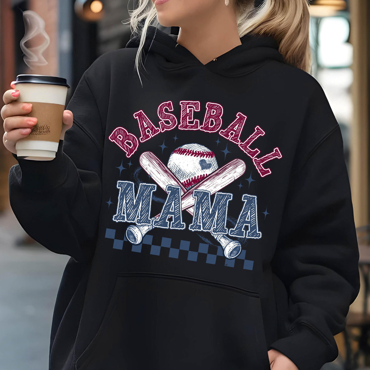 May include: Black hooded sweatshirt with the text "Baseball Mama" in red and blue lettering. A baseball and crossed bats are depicted in the center of the design.