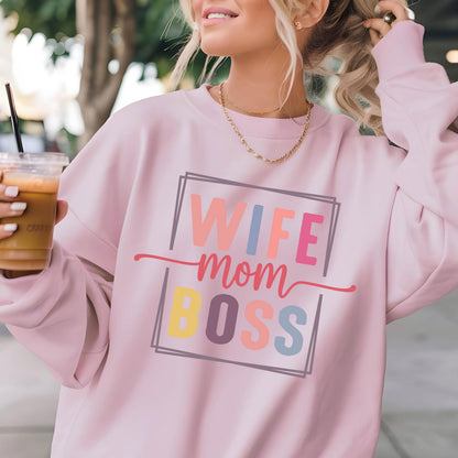 May include: Pink sweatshirt with the text "Wife Mom Boss" in a colorful block font.