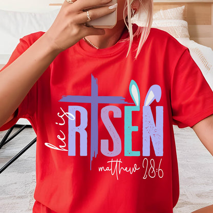 May include: Red t-shirt with a purple, blue, and green graphic that says "He is Risen" with a cross and bunny ears. The text "Matthew 28:6" is below the graphic.