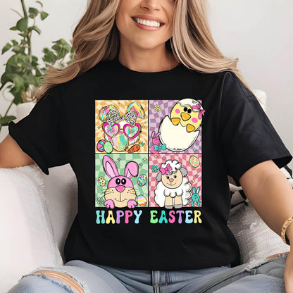 May include: Black t-shirt with a colorful "Happy Easter" graphic. The graphic features four squares with Easter-themed illustrations: a bunny with sunglasses, a chick hatching from an egg, a pink bunny, and a sheep.