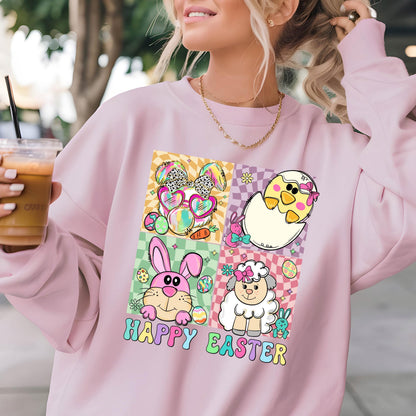 May include: Pink sweatshirt with a graphic print of four cartoon animals: a bunny, a chick, a lamb, and a bunny wearing sunglasses. The graphic is surrounded by a checkered pattern and the text "Happy Easter" is printed below the graphic.
