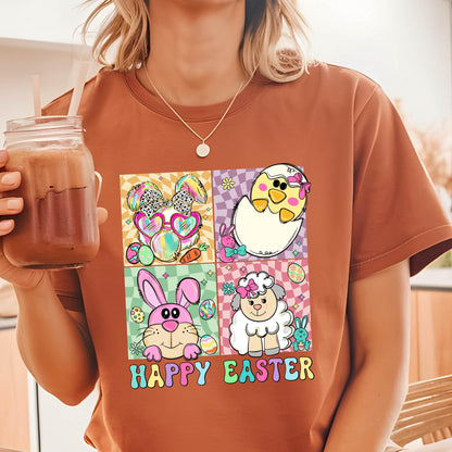 May include: A brown t-shirt with a graphic print of four cartoon animals in colorful squares. The animals are a bunny, a chick, a lamb, and a bunny wearing sunglasses. The text "Happy Easter" is printed below the squares.