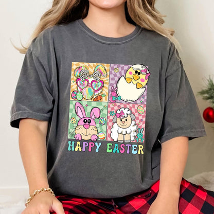 May include: A gray t-shirt with a colorful graphic of a bunny, chick, and lamb. The graphic is in a square shape with the text "Happy Easter" below it.