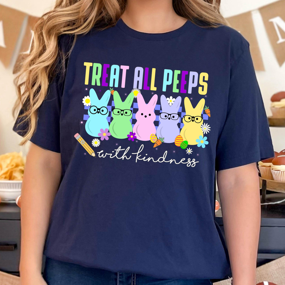 May include: Navy blue t-shirt with a graphic of five pastel-colored Peeps wearing glasses and the text "Treat all peeps with kindness".