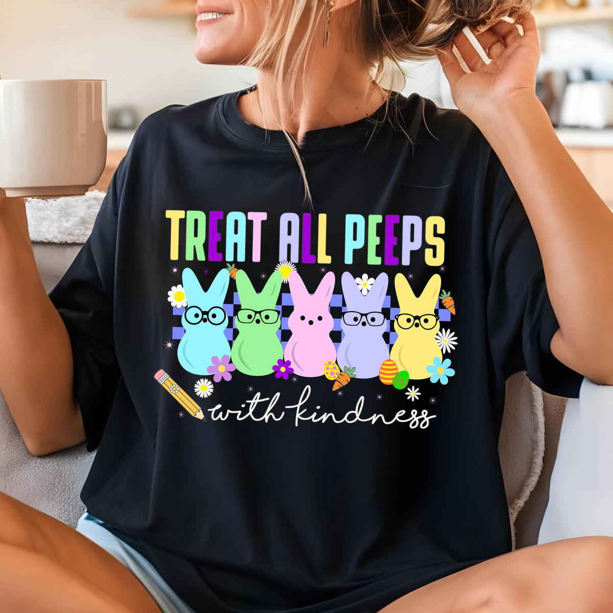 May include: Black t-shirt with a graphic of five colorful Peeps candy bunnies wearing glasses and the text "Treat all peeps with kindness".