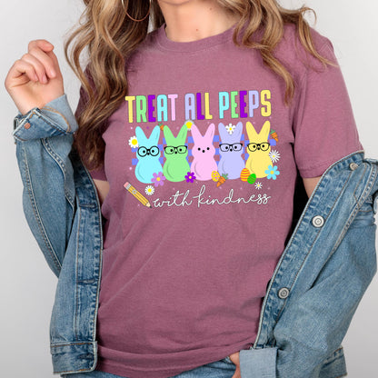 May include: A pink t-shirt with the text "Treat all peeps with kindness" and a graphic of five pastel-colored peeps wearing glasses. 
