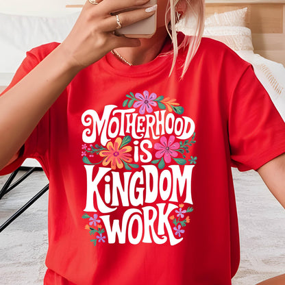 May include: Red t-shirt with a white graphic that says "Motherhood is Kingdom Work" surrounded by colorful flowers.