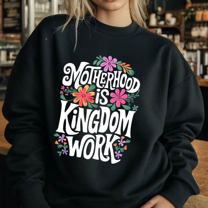 May include: Black sweatshirt with a white graphic that says "Motherhood is Kingdom Work" surrounded by colorful flowers.