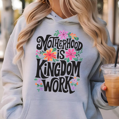 May include: A light gray hoodie with a floral design and the text "Motherhood is Kingdom Work" in black lettering.