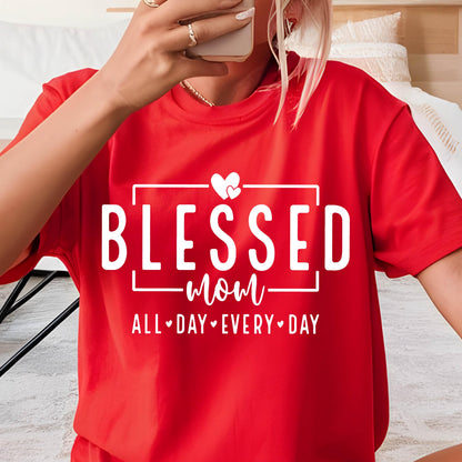 May include: Red t-shirt with white text that reads "Blessed mom all day every day" with two small hearts above the word "mom".