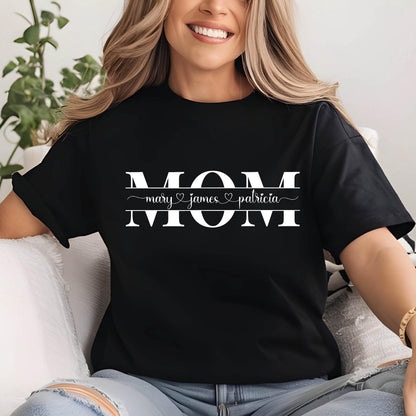 May include: Black t-shirt with the word "MOM" in white letters and the names "mary", "james", and "patricia" written below in a smaller font.