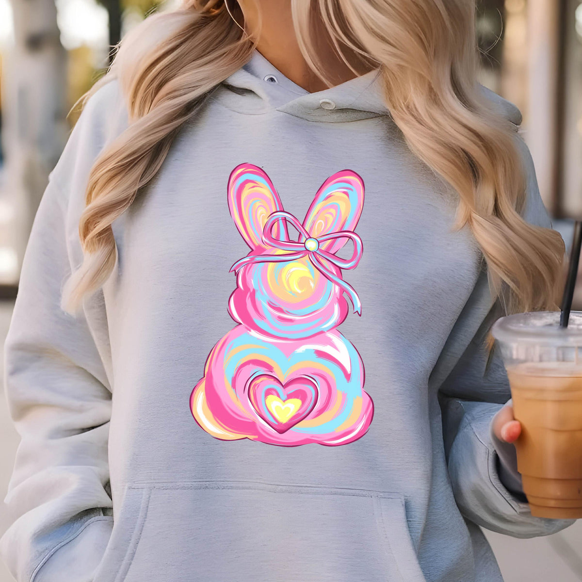 May include: A gray hoodie with a pink and blue swirl design of an Easter bunny with a yellow heart and a pink bow.