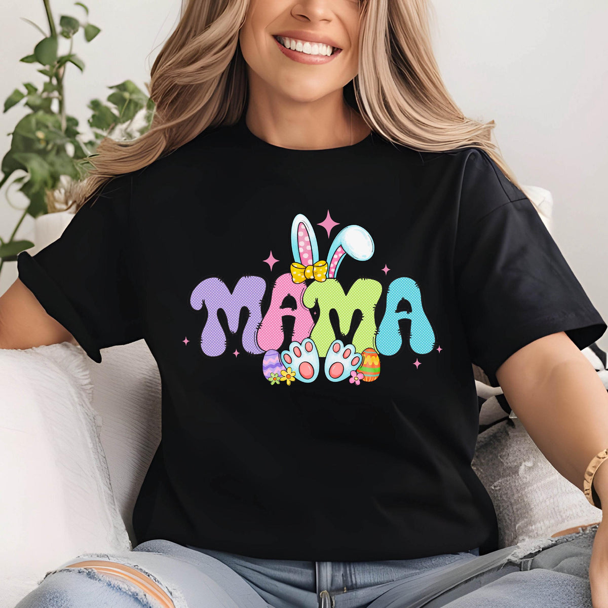 May include: Black t-shirt with a colorful Easter bunny graphic and the word "MAMA" in a playful font.