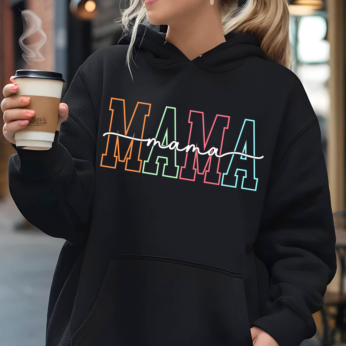 May include: Black hoodie with a rainbow colored "MAMA" graphic and the word "mama" written in cursive underneath.