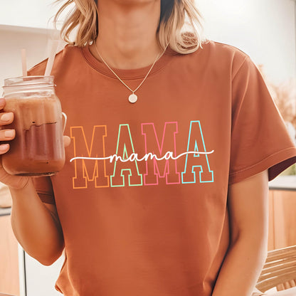 May include: A brown t-shirt with the word "MAMA" printed in rainbow colors with a handwritten "mama" underneath.