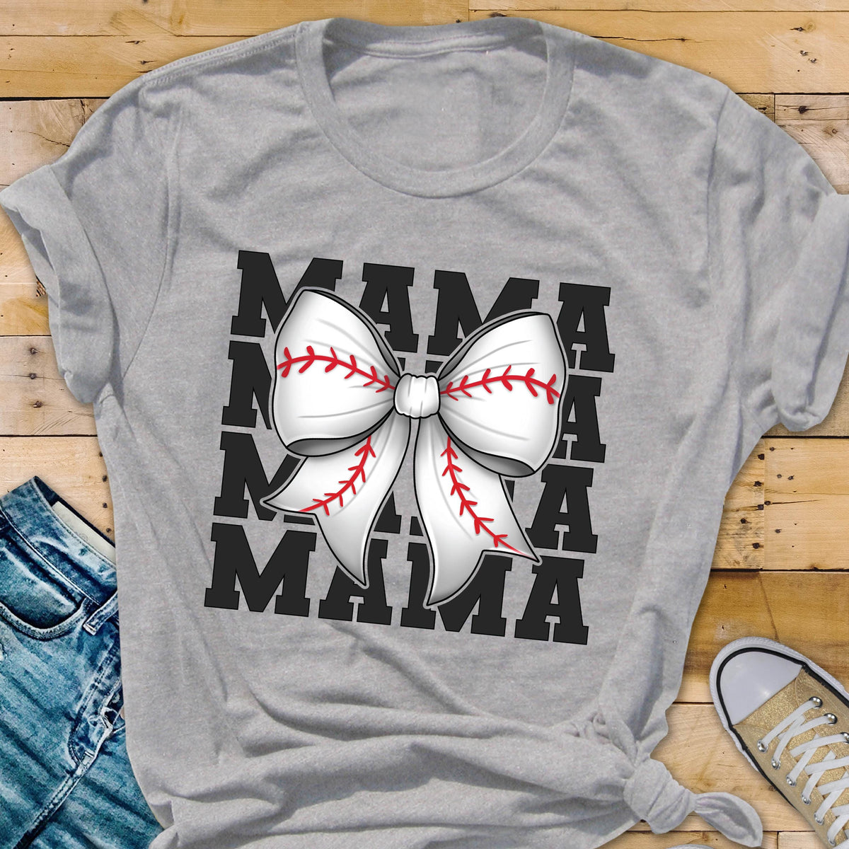 May include: Gray t-shirt with a black graphic of the word "MAMA" repeated four times with a white baseball-stitched bow in the center.